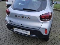 Gebraucht Dacia Spring Extreme 47 kW (65 PS) 2023 Diamantsilbergrau Kleinwagen