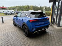 Gebraucht Opel Mokka-e Elegance 100 kW (136 PS) 2023 Kontrast grau/quarz silber SUV