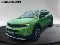 Gebraucht Opel Mokka Elegance 131 PS (96 kW) 2022 Matcha grün (metallic) SUV