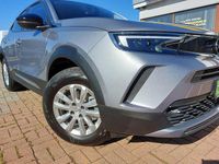 Gebraucht Opel Mokka-e Edition 100 kW (136 PS) 2021 Kontrast grau/quarz silber SUV