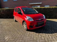 Gebraucht Daihatsu Cuore 69 PS (50 kW) 2011 Rot Kleinwagen