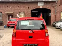 Gebraucht Daihatsu Cuore 69 PS (50 kW) 2010 Rot Kleinwagen