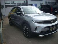 Gebraucht Opel Mokka-e Elegance 100 kW (136 PS) 2022 Kontrast grau/quarz silber SUV