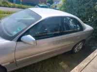 Second-hand Opel Omega 144 CP (105 kW) 2000 Argintiu Berlinǎ