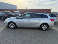 Używany Opel Astra Design Edition 95 KM (69 kW) 2011 Srebrny Kombi