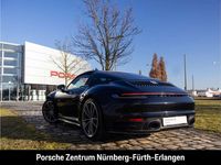 Gebraucht Porsche 992 385 PS (283 kW) 2023 Tiefschwarzmetallic Coupé