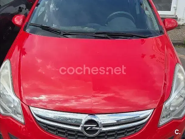 Usado Opel Corsa Selective 75 HP (55 kW) 2011 Vermelho Citadino