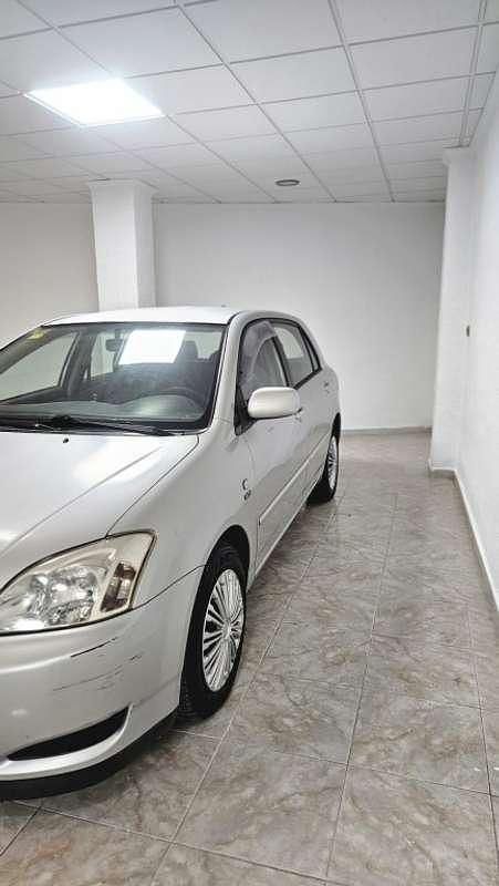 Käytetty Toyota Corolla 97 HP (71 kW) 2003 Harmaa Viistoperä