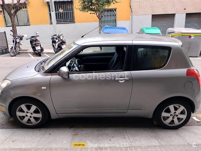 Usado Suzuki Swift GLX 92 CV (67 kW) 2010 Gris / plata Berlina