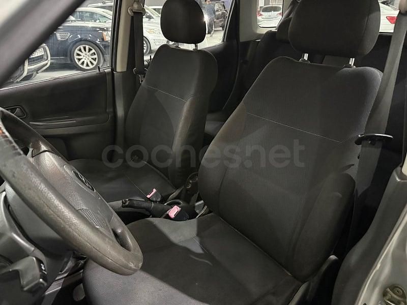 Usado Suzuki Ignis 99 CV (72 kW) 2004 Gris / plata Utilitario