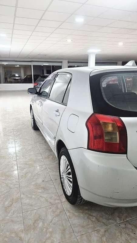 Käytetty Toyota Corolla 97 HP (71 kW) 2003 Harmaa Viistoperä