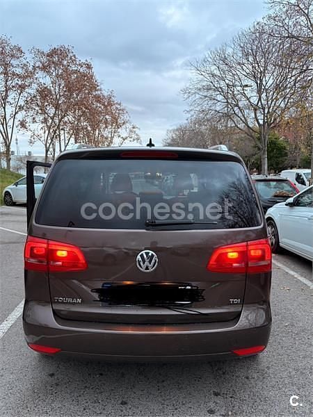 Usado VW Touran Advance 105 CV (77 kW) 2010 Granate Monovolumen