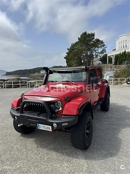 Rojo Usado 2012 Jeep Wrangler Unlimited Sahara SUV | 32.900 € (Precio justo) - Imagen 1/4