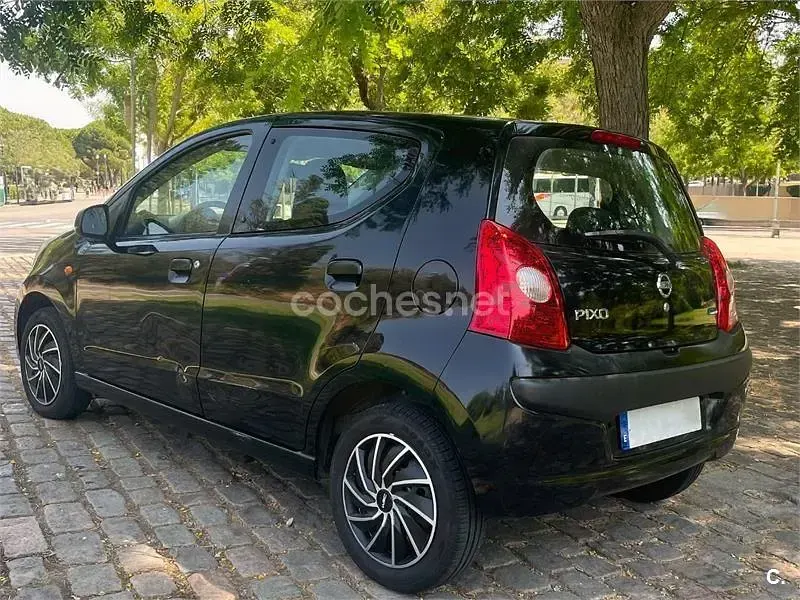 Usado Nissan Pixo Acenta 68 CV (50 kW) 2010 Negro Utilitario