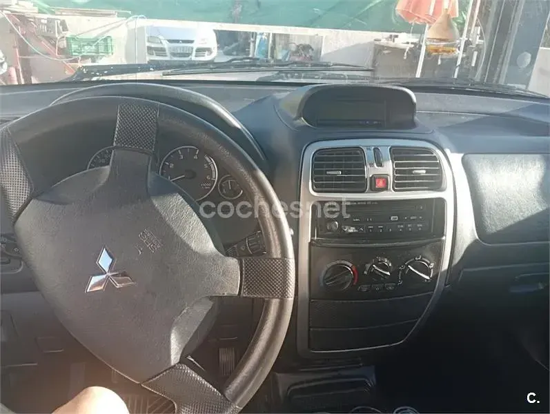 Usado Mitsubishi Space Star 102 CV (75 kW) 2004 Gris / plata Monovolumen