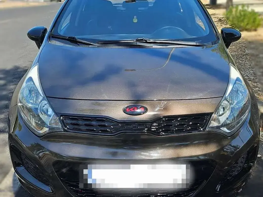Usado Kia Rio 90 CV (66 kW) 2012 Marrón Utilitario