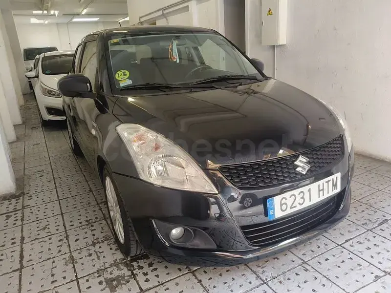 Usado Suzuki Swift GLX 75 CV (55 kW) 2012 Negro Utilitario