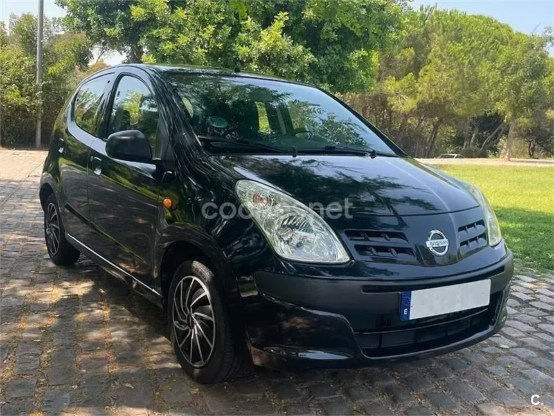 Usado Nissan Pixo Acenta 68 CV (50 kW) 2010 Negro Utilitario