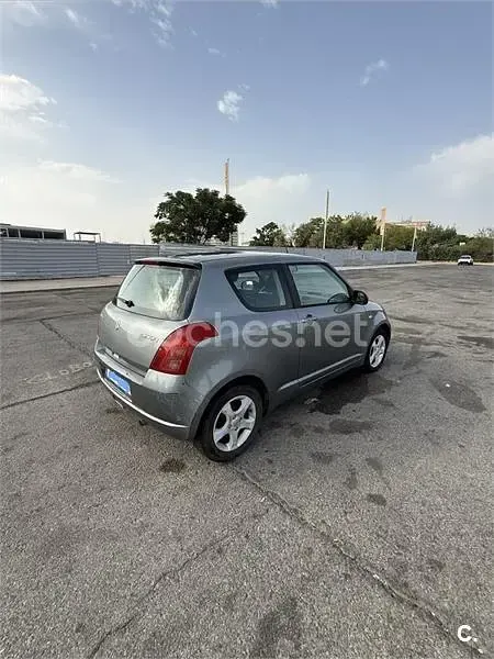 Usado Suzuki Swift GLX 92 CV (67 kW) 2006 Gris / plata Utilitario
