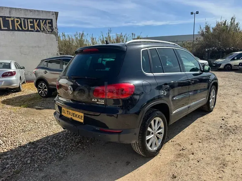 Käytetty VW Tiguan 140 HP (102 kW) 2014 Musta Katumaasturi