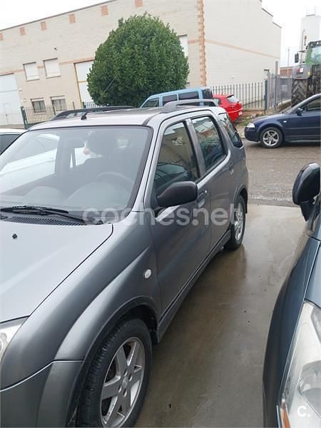 Usado Suzuki Ignis 99 CV (72 kW) 2004 Gris / plata Utilitario