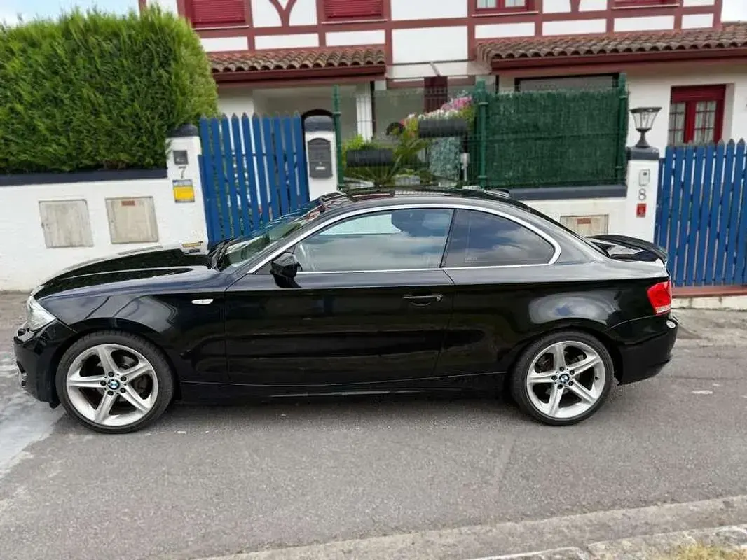Usado BMW 118 143 CV (105 kW) 2012 Negro Utilitario