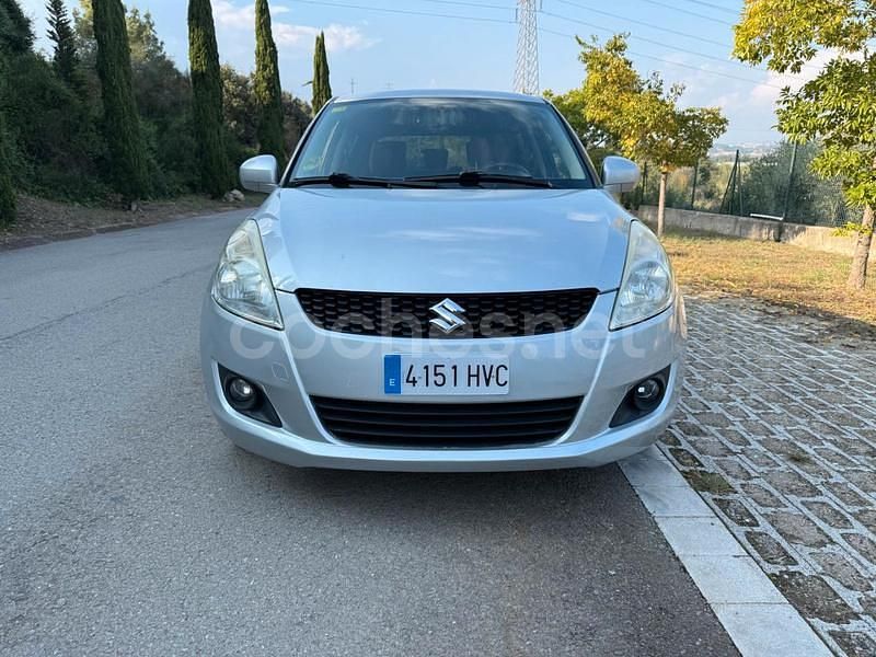 Usado Suzuki Swift GLX 75 CV (55 kW) 2013 Gris / plata Utilitario
