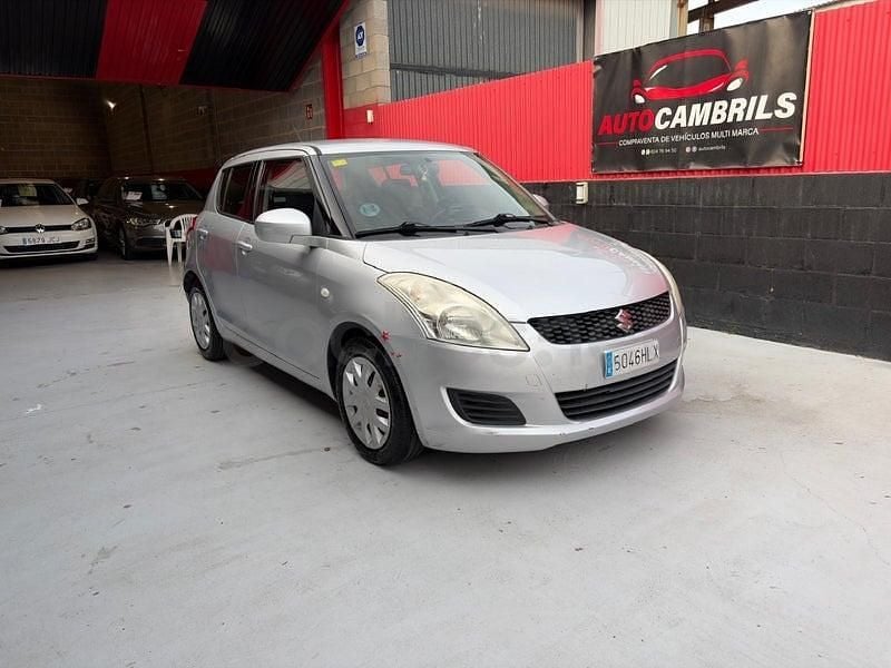 Usado Suzuki Swift GLX 95 CV (69 kW) 2012 Gris / plata Utilitario