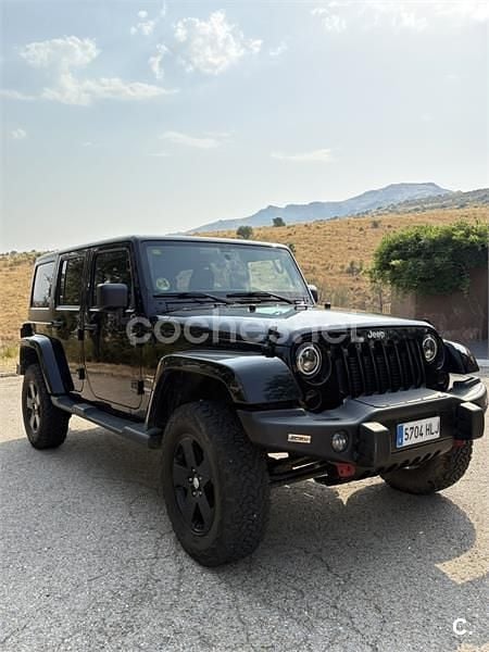 Negro Usado 2012 Jeep Wrangler Unlimited Sahara SUV | 33.900 € (Precio justo) - Imagen 1/4