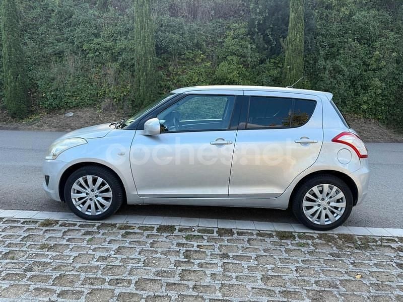 Usado Suzuki Swift GLX 75 CV (55 kW) 2013 Gris / plata Utilitario