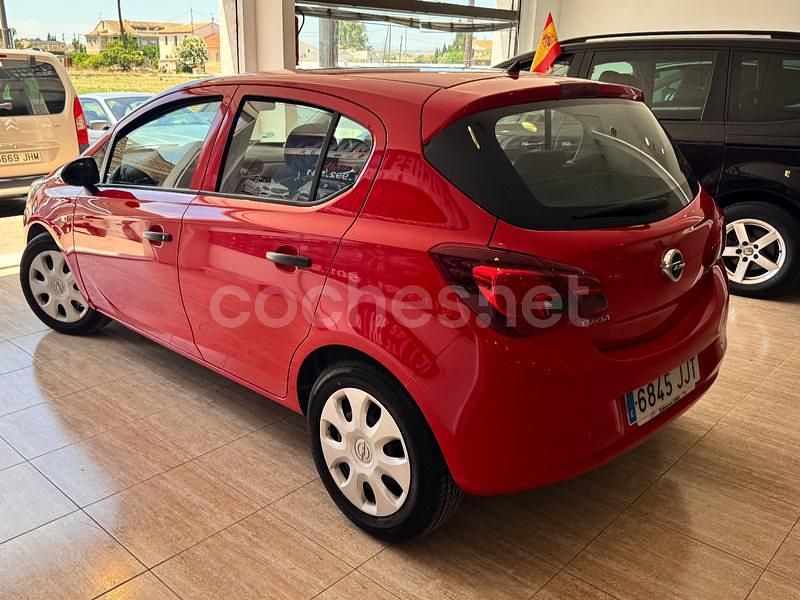 Usado Opel Corsa Selective 75 CV (55 kW) 2015 Granate Utilitario