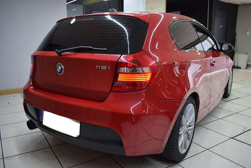 Usado BMW 118 Sport Line 143 CV (105 kW) 2010 Rojo Utilitario