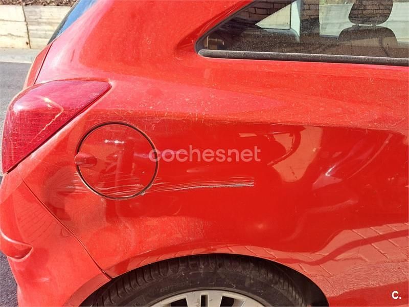 Usado Opel Corsa Selective 85 HP (62 kW) 2013 Vermelho Citadino