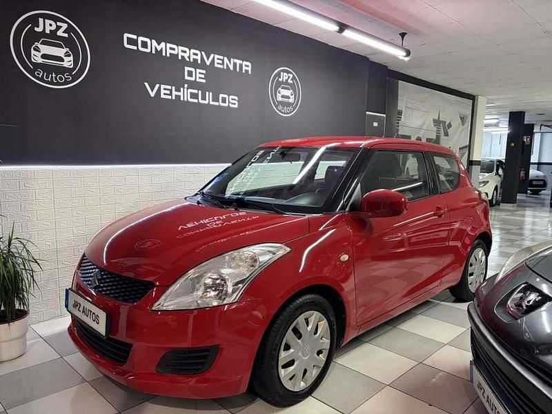Rojo Usado 2013 Suzuki Swift Utilitario | 6490 € - Imagen 1/4