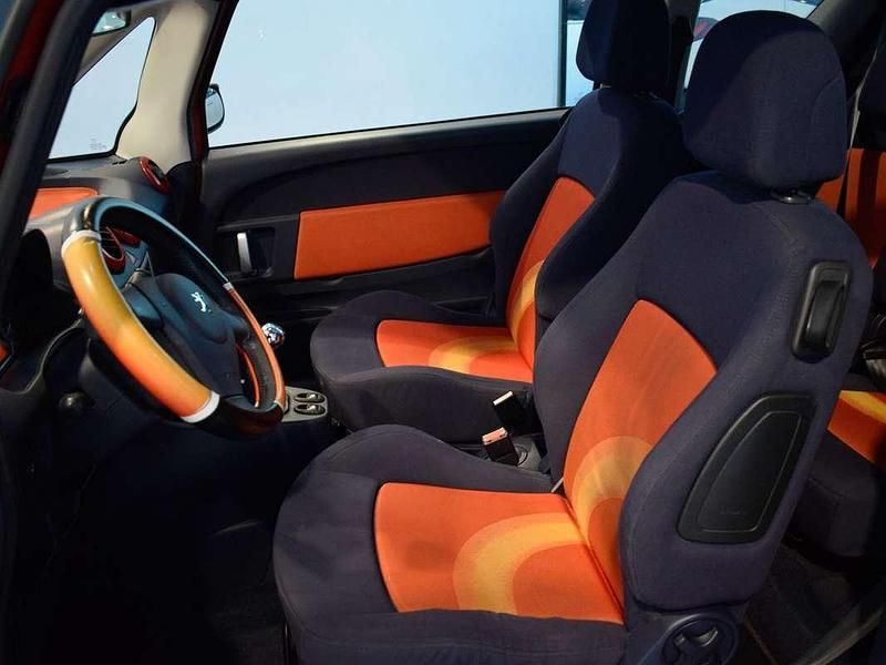 Usado Peugeot 1007 69 CV (50 kW) 2007 Rojo Monovolumen