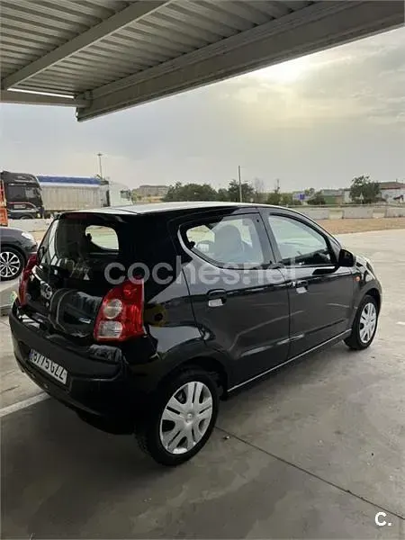 Usado Nissan Pixo Acenta 68 CV (50 kW) 2010 Negro Utilitario