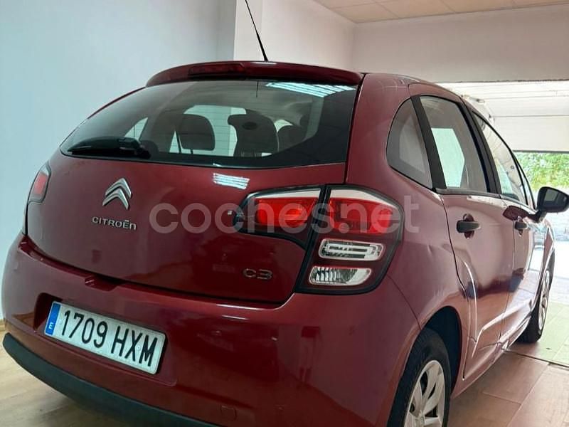 Usado Citroën C3 Attraction 68 CV (50 kW) 2014 Granate Utilitario