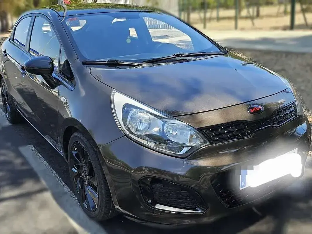 Usado Kia Rio 90 CV (66 kW) 2012 Marrón Utilitario