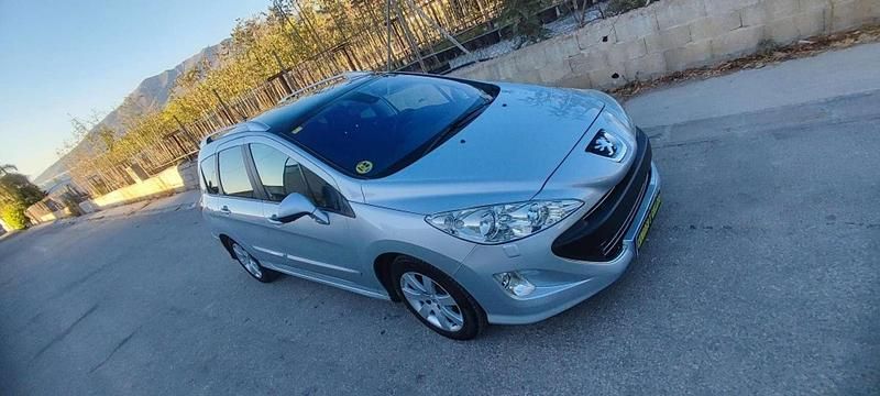 Gris Usado 2011 Peugeot 308 SW Sportium Familiar | 5800 € - Imagen 1/4