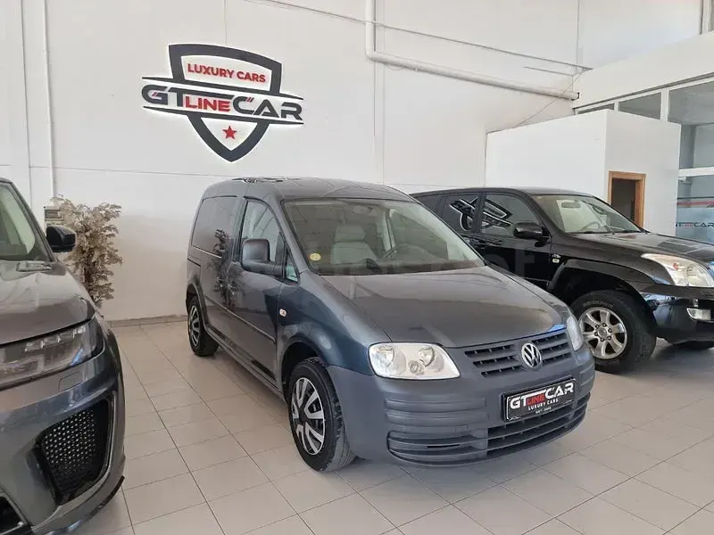 Usado VW Caddy 105 CV (77 kW) 2009 Gris / plata Monovolumen