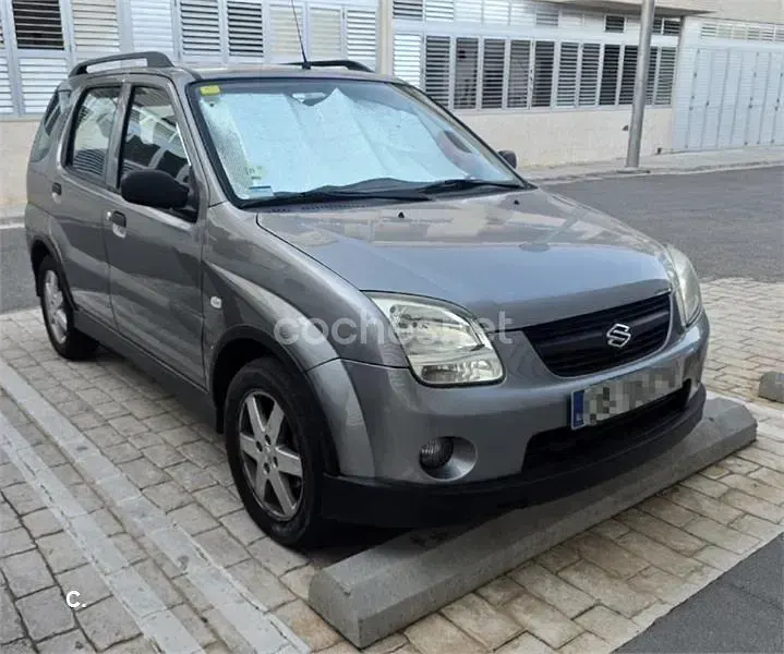 Usado Suzuki Ignis 69 CV (50 kW) 2006 Gris / plata Utilitario