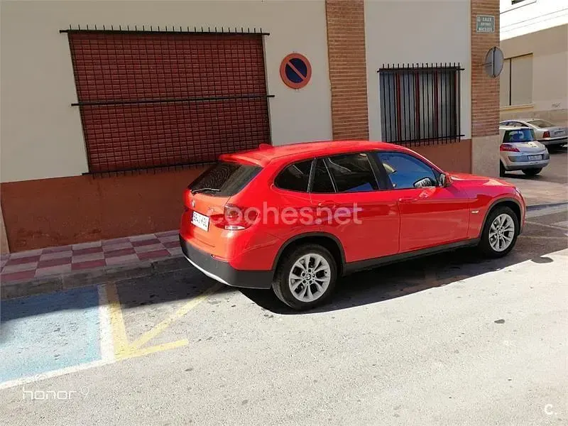 Używany BMW X1 143 KM (105 kW) 2011 Czerwony SUV