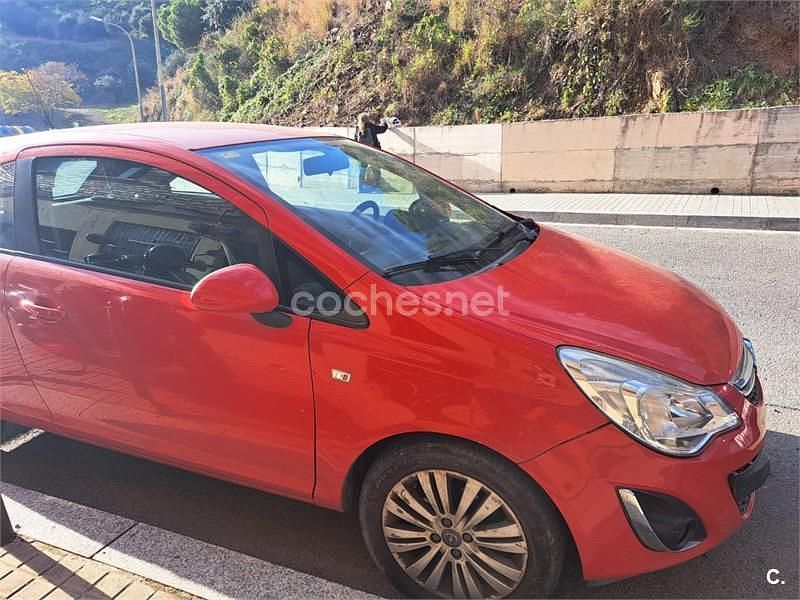 Usado Opel Corsa Selective 85 HP (62 kW) 2013 Vermelho Citadino