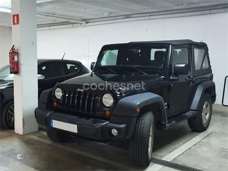 Negro Usado 2013 Jeep Wrangler Sport SUV | 27.600 € (Caro) - Imagen 1/4