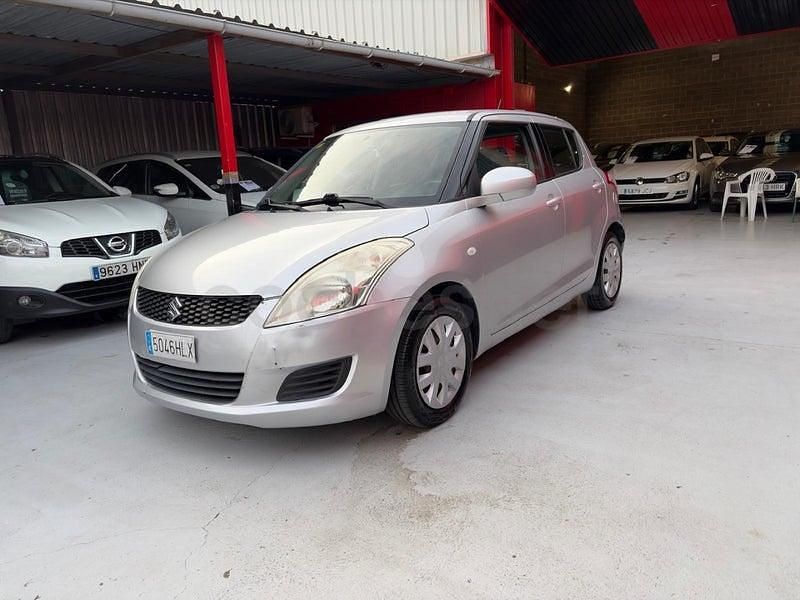 Usado Suzuki Swift GLX 95 CV (69 kW) 2012 Gris / plata Utilitario