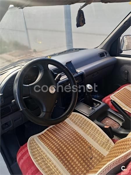 Usado Nissan Cargo 75 CV (55 kW) 1997 Blanco Familiar