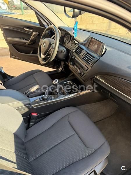 Usado BMW 118 Sport Line 170 CV (125 kW) 2011 Negro Utilitario