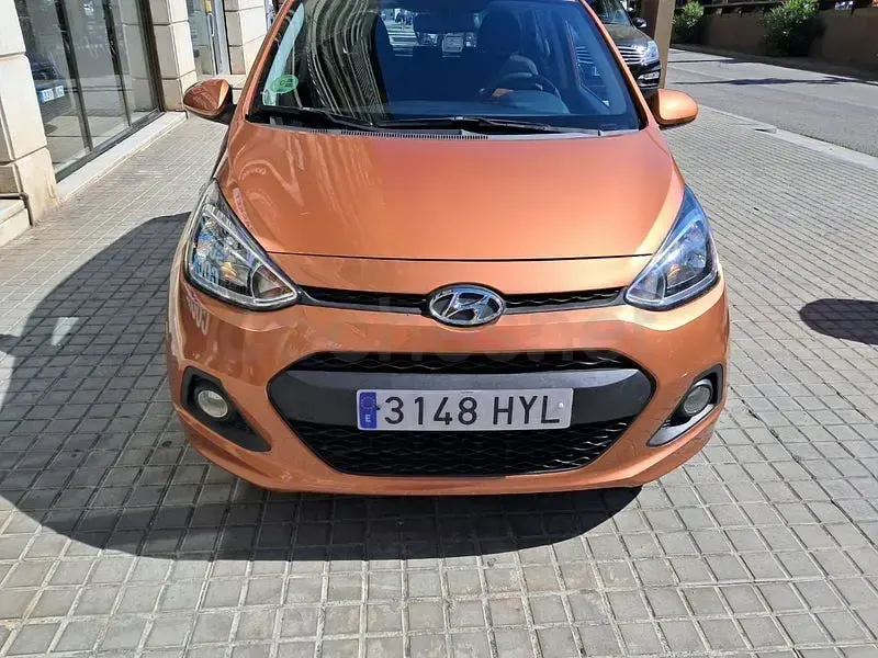 Usado Hyundai i10 66 CV (48 kW) 2014 Naranja Utilitario