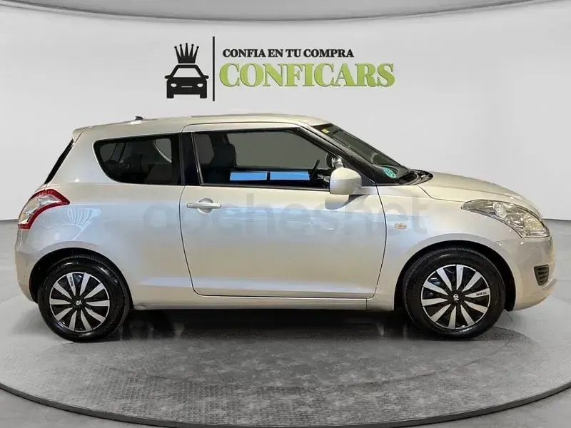 Usado Suzuki Swift 95 CV (69 kW) 2013 Gris / plata Utilitario