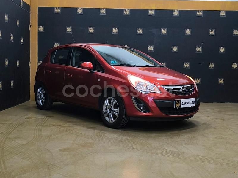 Usado Opel Corsa Selective 85 CV (62 kW) 2013 Naranja Berlina